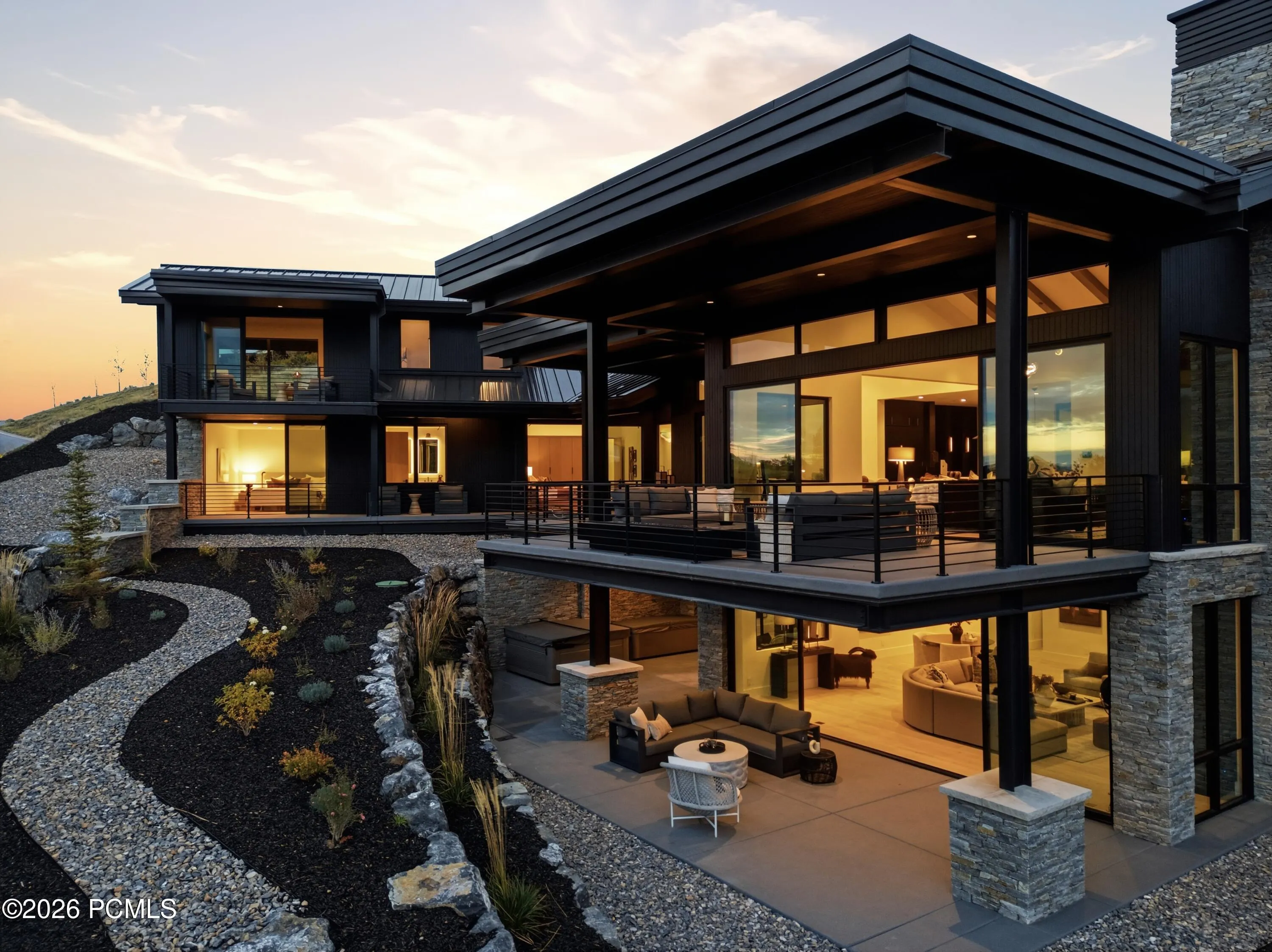 An artfully terraced landscape unfolds in a series of elevations, where natural stone walkways meander through richly textured plantings & carefully composed garden settings. The interplay of rugged rock, carefully cultivated grounds & the mountainside’s natural contours creates an atmosphere of serene refinement, reminiscent of the grounds of an exclusive mountain sanctuary. An elegant expression of landscape design that brings a sense of tranquility, balance & quiet distinction to the property.