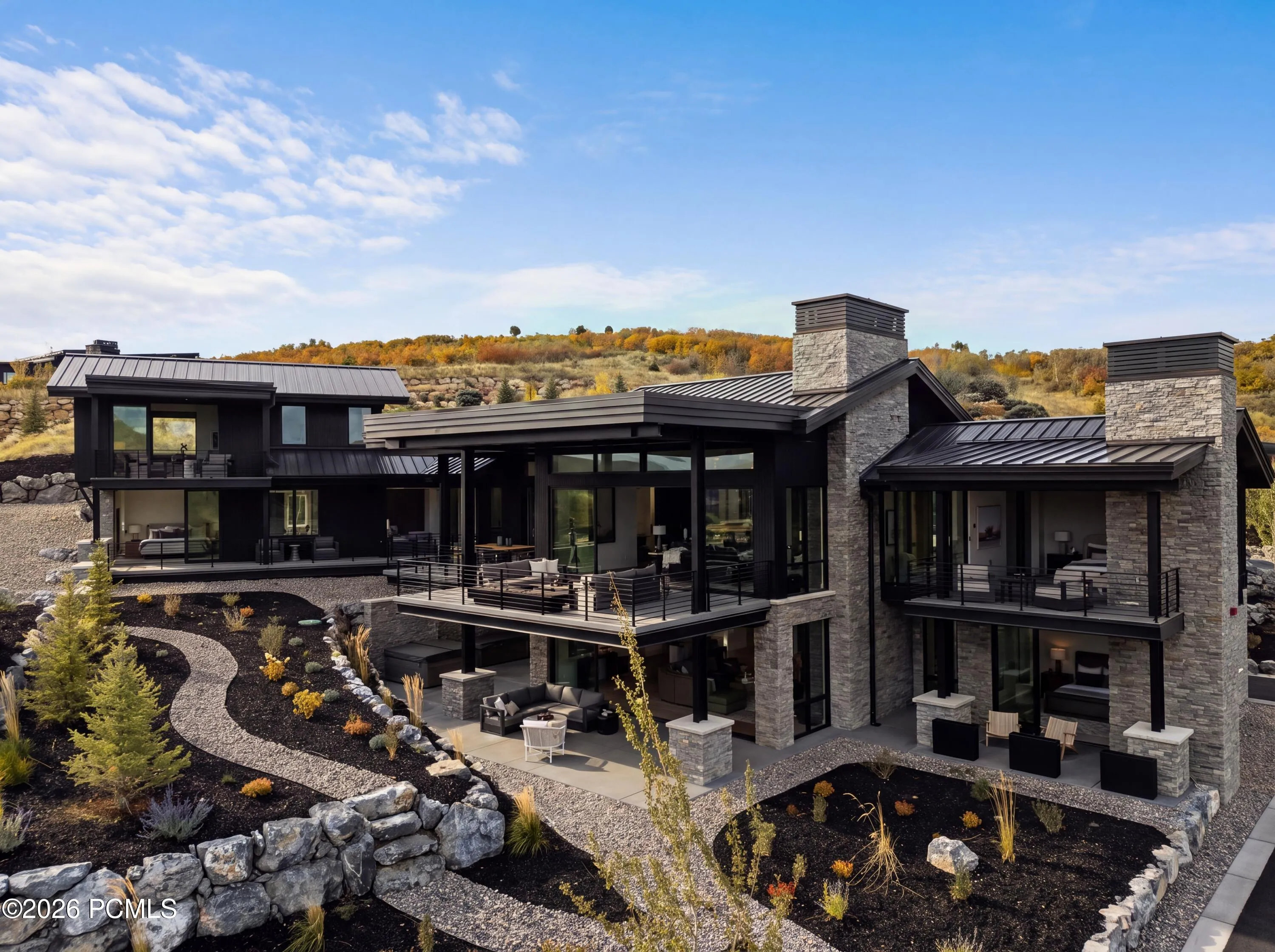 An extraordinary level of refinement extends beyond the visible, where sophisticated technology, bespoke comforts & meticulous attention to detail redefine elevated mountain living. The culinary experience is distinguished by a premier Wolf & Sub-Zero appliance suite, including dual Sub-Zero wine refrigerators, complemented by whole-home water filtration, water softener & dedicated kitchen reverse osmosis. An extensive low-voltage infrastructure seamlessly integrates Control4 smart home technology, curated lighting scenes, personalized ambiance & intuitive controls. All 5 ensuites are prewired for tvs, with additional prewiring for automated window treatments throughout. Integrated indoor/outdoor audio, comprehensive security with surveillance cameras & WaterCop leak detection further enhance the residence. An exceptional commitment to year-round comfort is reflected in whole-home humidification, upgraded HEPA air filtration, dual-zone climate control & radiant-heated bathroom floors.