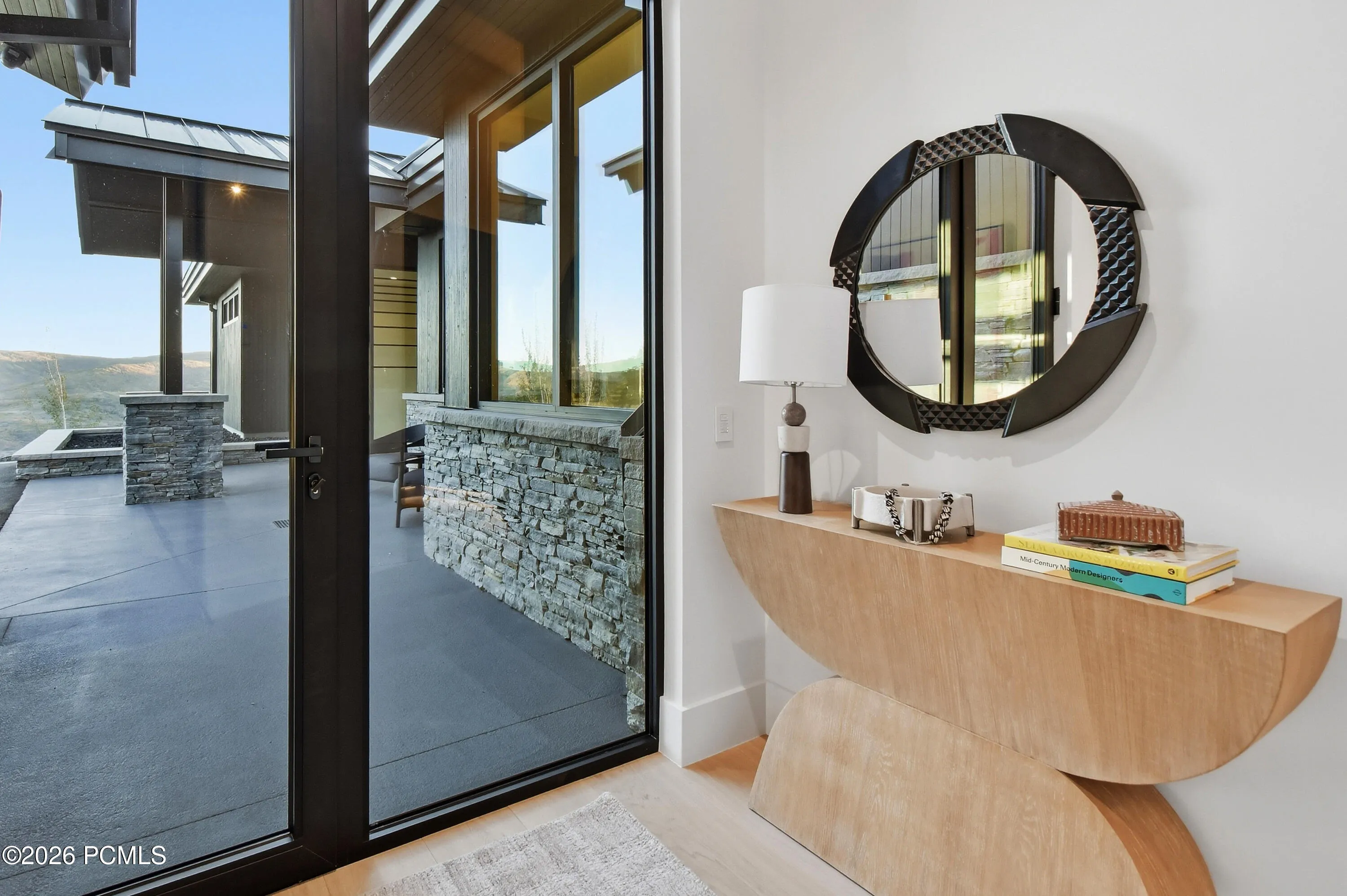 An elegantly conceived secondary entrance introduces a distinctive level of privacy & personalized convenience, allowing private staff & service personnel to move discreetly behind the scenes. This thoughtful addition preserves the intimate atmosphere of the home, ensuring gracious hospitality & uninterrupted moments with family & friends.