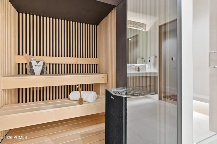 Indulge in the time honored ritual of sauna bathing within an expansive, tiered sanctuary designed to accommodate four or more guests. The enveloping heat & elevated seating create an immersive experience reminiscent of the world’s most distinguished wellness retreats, inviting lingering sessions of warmth, tranquility & renewal. Whether enjoyed in solitude or shared with guests, this dedicated sauna brings the privilege of a destination spa into the intimacy of your own mountain estate.