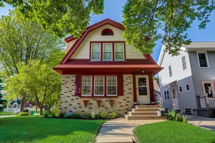 Charming Shorewood duplex with attached garage on idyllic tree lined street.