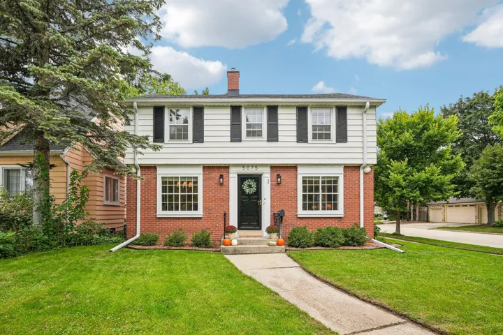 Classic center hall Colonial on a one-of-a-kind corner lot.