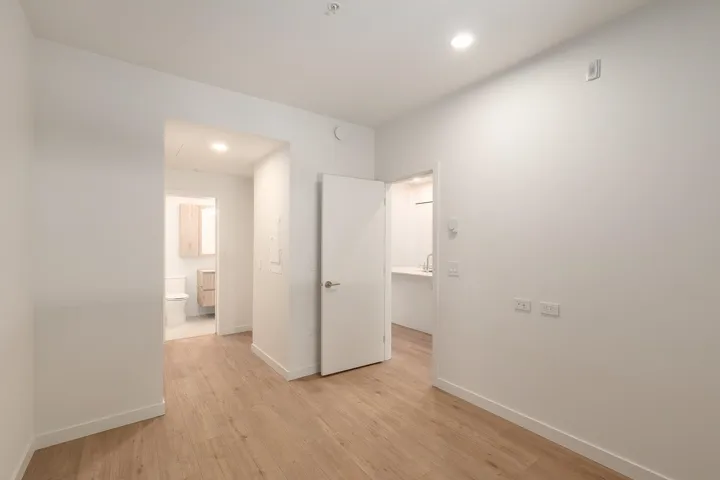 Bright interior space featuring light wood-finish flooring