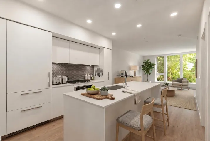 Contemporary kitchen featuring an integrated refrigerator, hexagon tile backsplash, gas range, recessed lighting, and a center island with an undermount sink