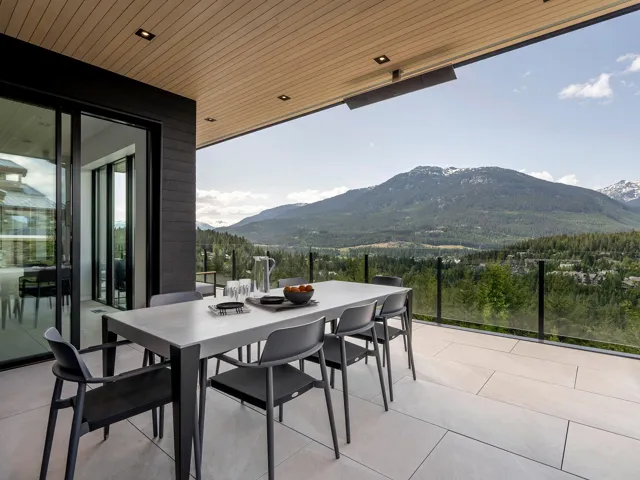 View of patio with outdoor dining area and a mountain view