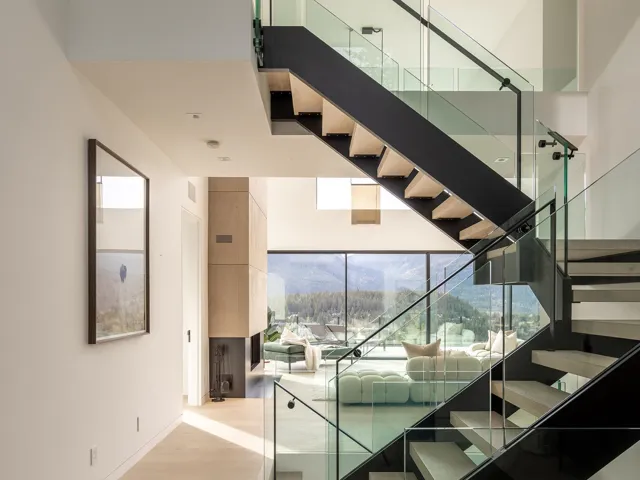 Stairway with a mountain view and wood finished floors
