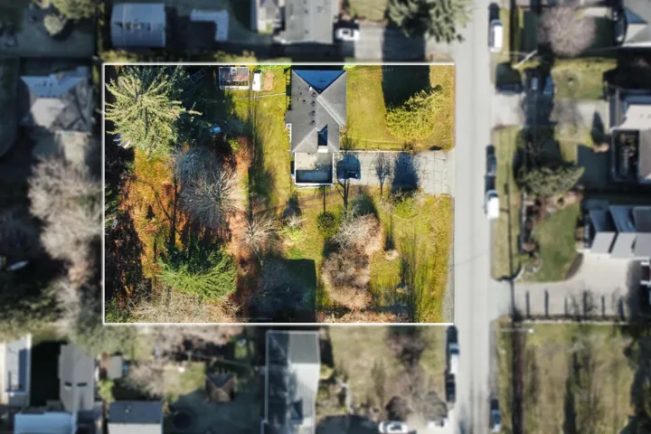 Aerial view of residential area featuring property boundaries highlighted