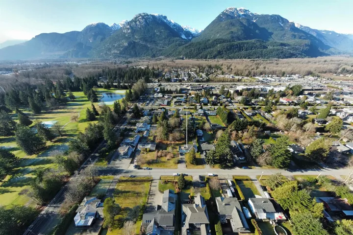 Aerial view of residential area featuring a water and mountain view