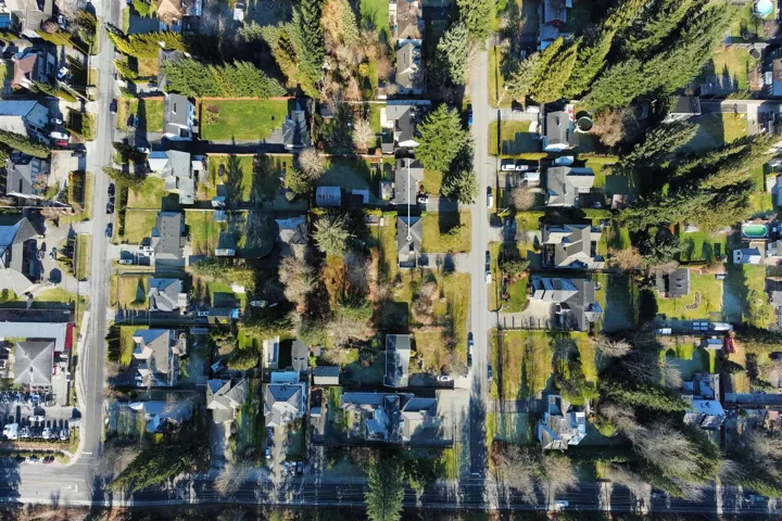 Aerial view of property's location featuring nearby suburban area