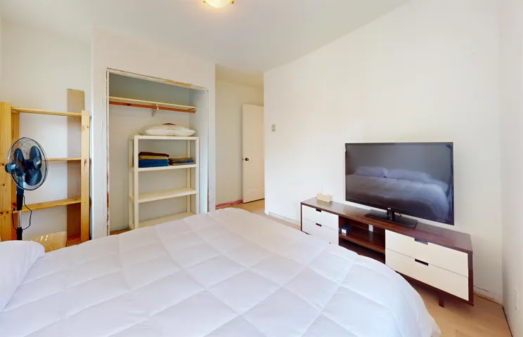 Bedroom featuring a closet and baseboards