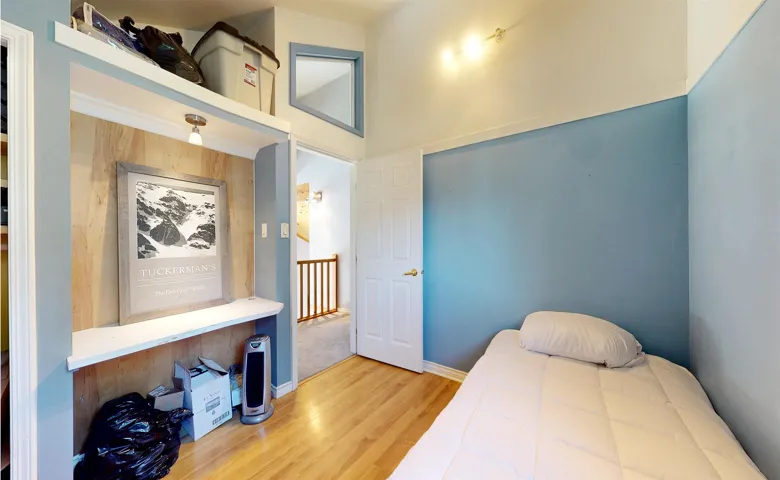 Bedroom with wood finished floors