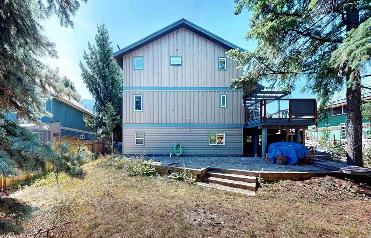Rear view of property with a wooden deck