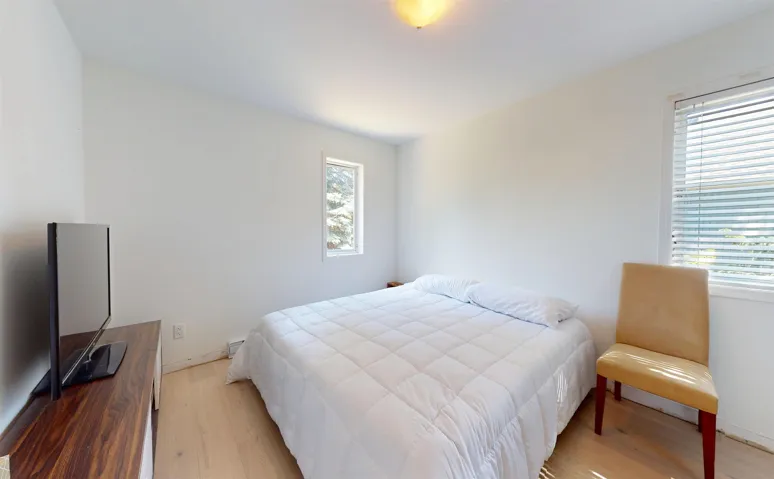 Bedroom with light wood finished floors