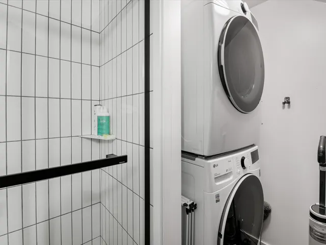 Laundry area with stacked washer / dryer and laundry area