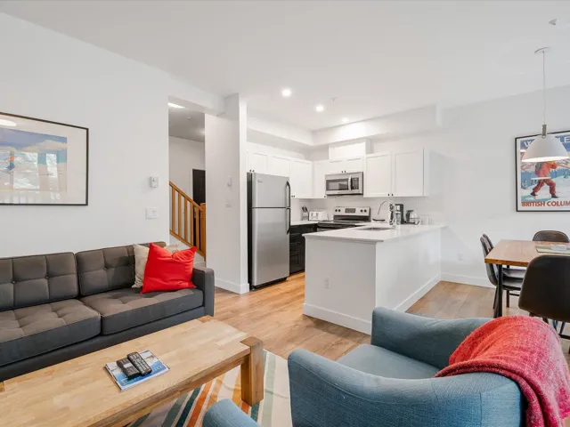 Living area with stairway, recessed lighting, light wood finished floors, and baseboards