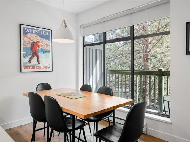 Dining area with wood finished floors and baseboards