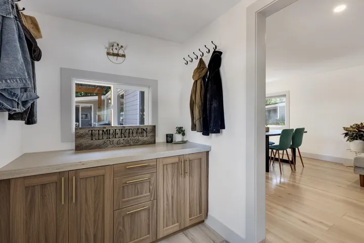 Bar area with light wood-style floors and baseboards