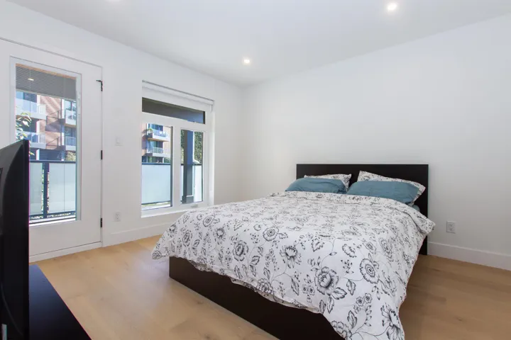 Bedroom featuring light wood finished floors, recessed lighting, and baseboards