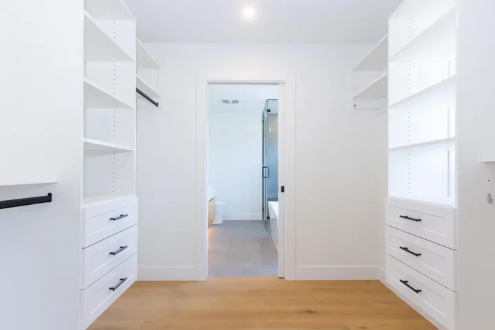 Walk in closet featuring light wood-style floors