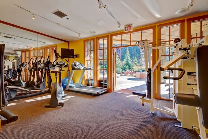 Exercise room featuring expansive windows