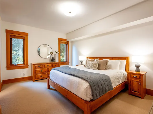 Bedroom featuring carpet and baseboards