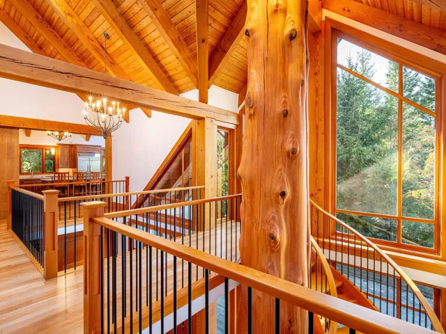 Staircase with wood finished floors, a chandelier, and wooden ceiling