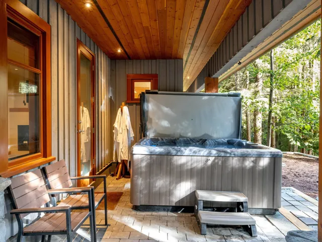 View of patio / terrace with a hot tub