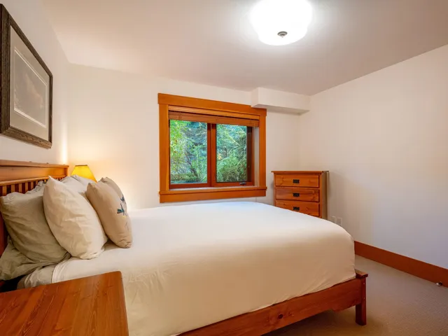 Carpeted bedroom featuring baseboards