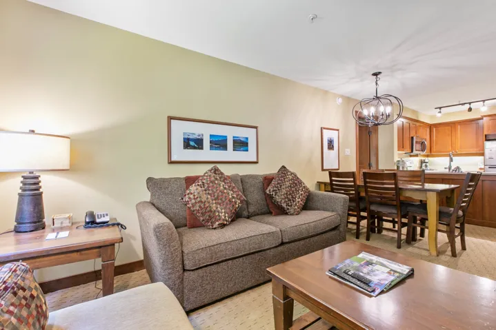 Living area with a chandelier and rail lighting