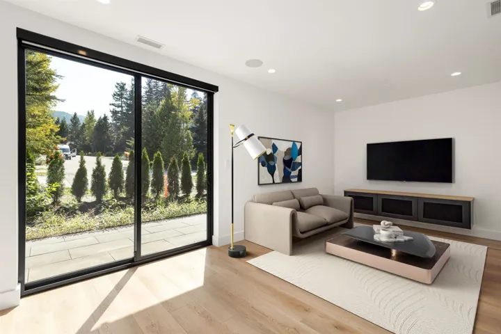 Living area featuring wood finished floors and recessed lighting