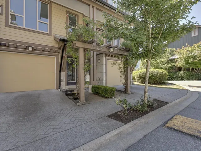 View of front of property featuring a garage and driveway