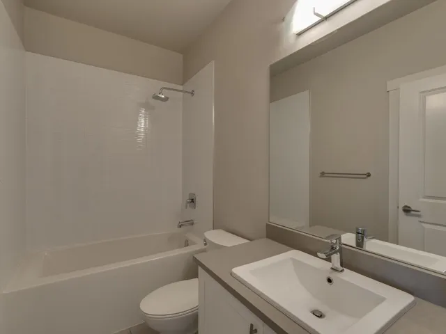 Bathroom featuring vanity and shower / tub combination