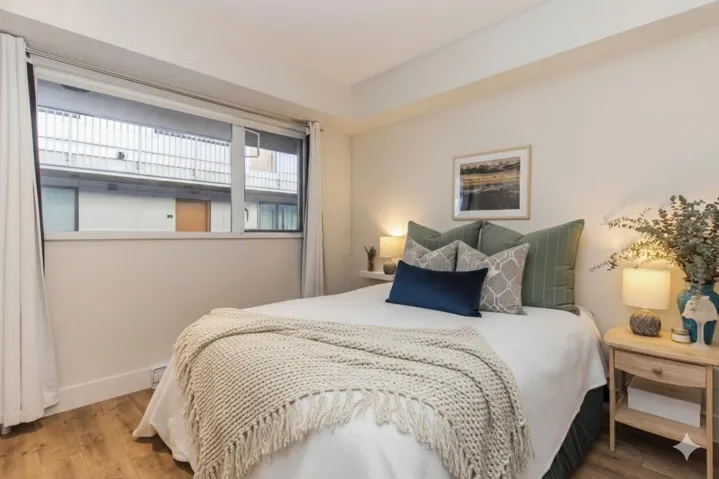 Bedroom featuring wood finished floors and baseboards