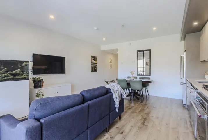 Living room featuring light wood-type flooring and recessed lighting