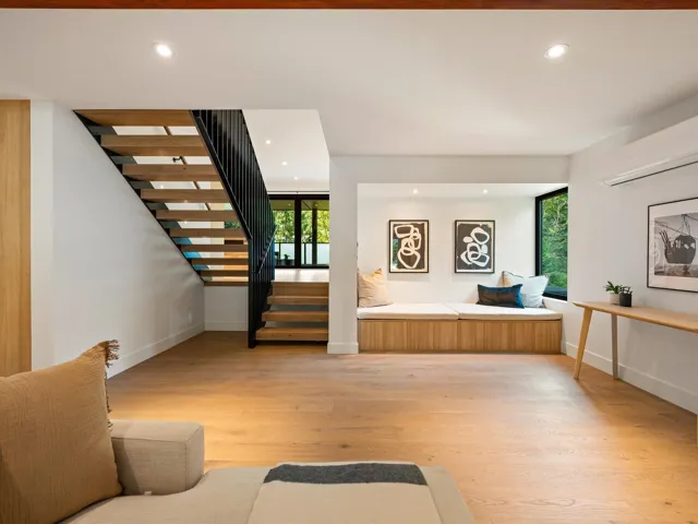 Entryway featuring light wood finished floors, recessed lighting, stairs, and an AC wall unit