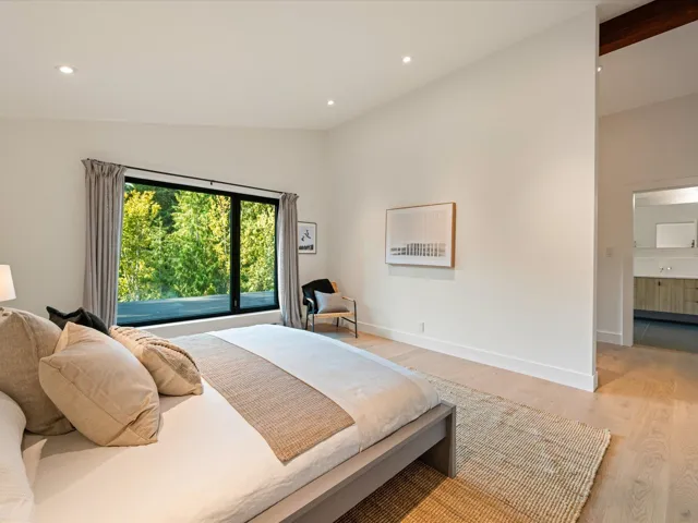 Bedroom featuring recessed lighting, light wood-style floors, and vaulted ceiling