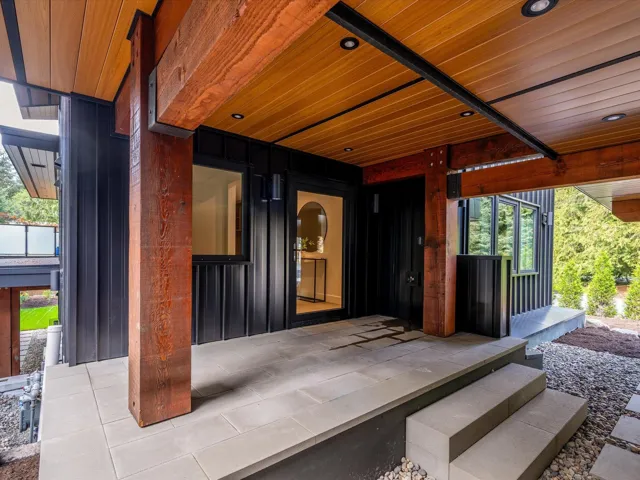 Doorway to property featuring a patio area
