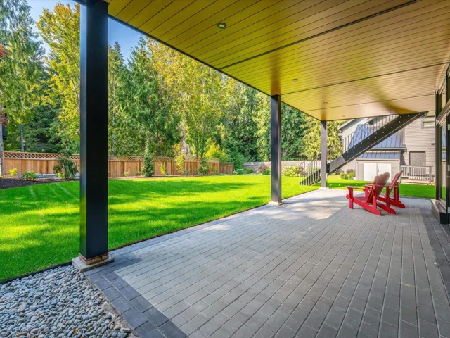 Fenced backyard with a patio