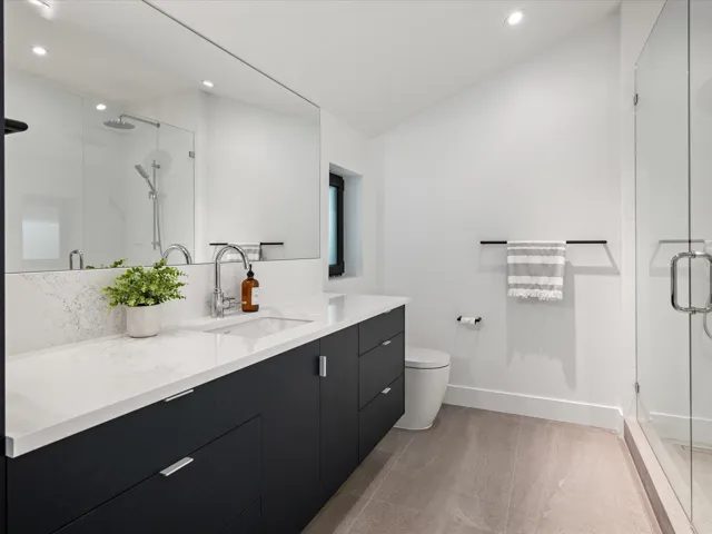 Bathroom with vanity, a stall shower, recessed lighting, and light wood-style flooring