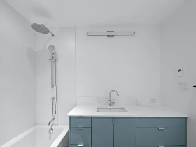 Full bath featuring shower / bathtub combination and vanity