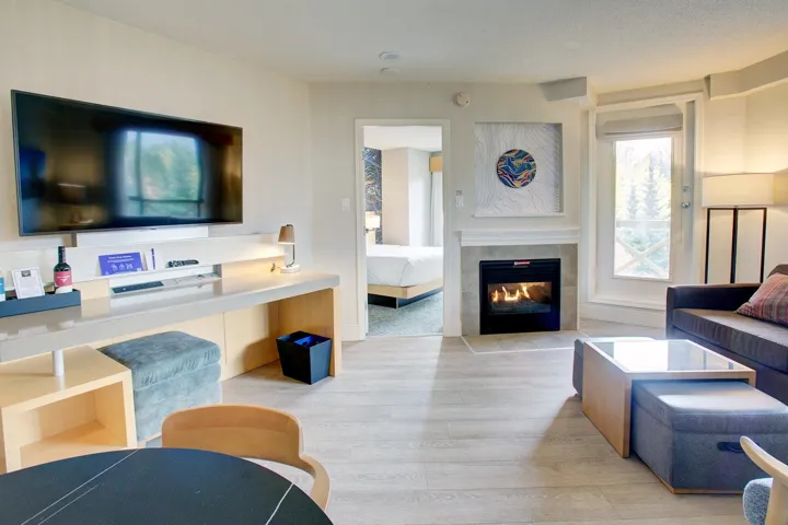 Living area featuring light wood-style floors and a fireplace
