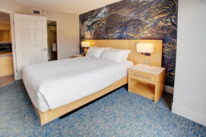 Bedroom with wallpapered walls