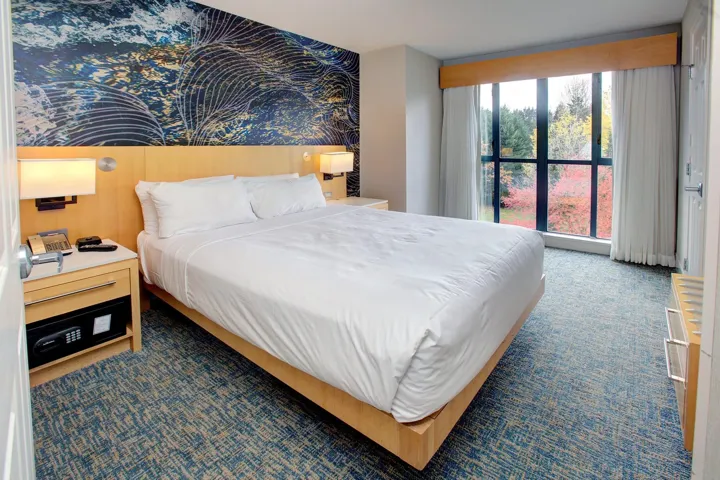 Bedroom featuring dark colored carpet