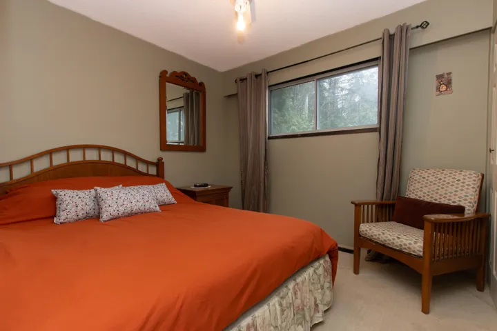 Bedroom with light colored carpet