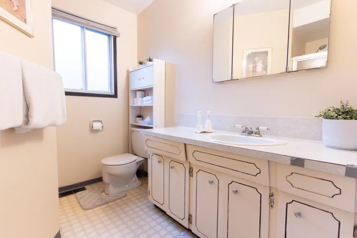 Bathroom with visible vents, tile patterned floors, vanity, and toilet