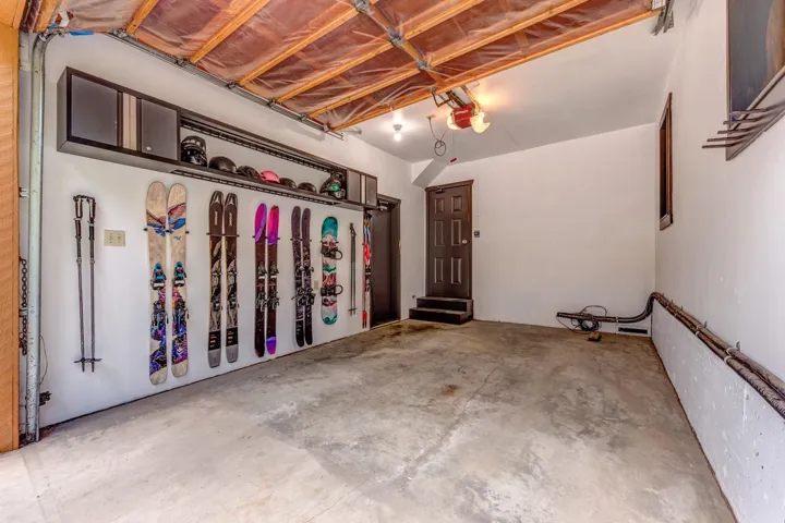 Garage featuring a garage door opener