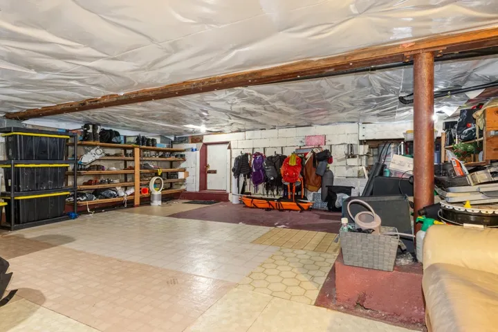 Unfinished basement featuring tile patterned floors