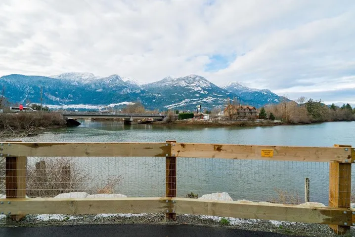 Water view with mountains & future Redbridge allowing pedestrian access to Downtown Squamish.