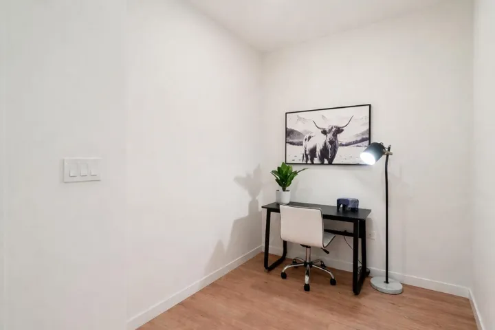 Office space with light wood finished floors and baseboards