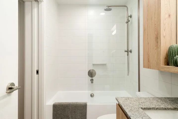 Full bathroom with shower / washtub combination and vanity